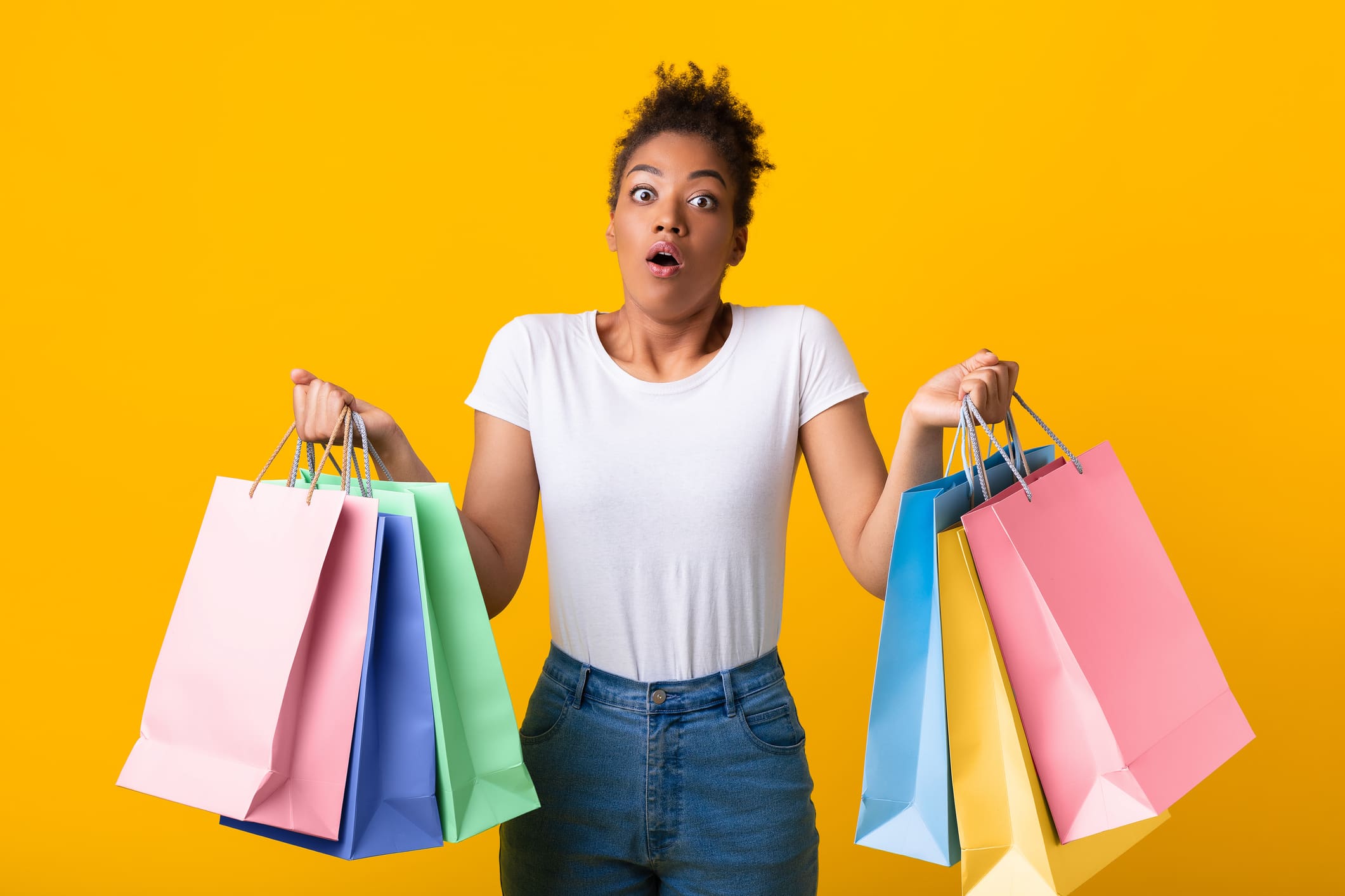Portrait of a lady holding shopping bags