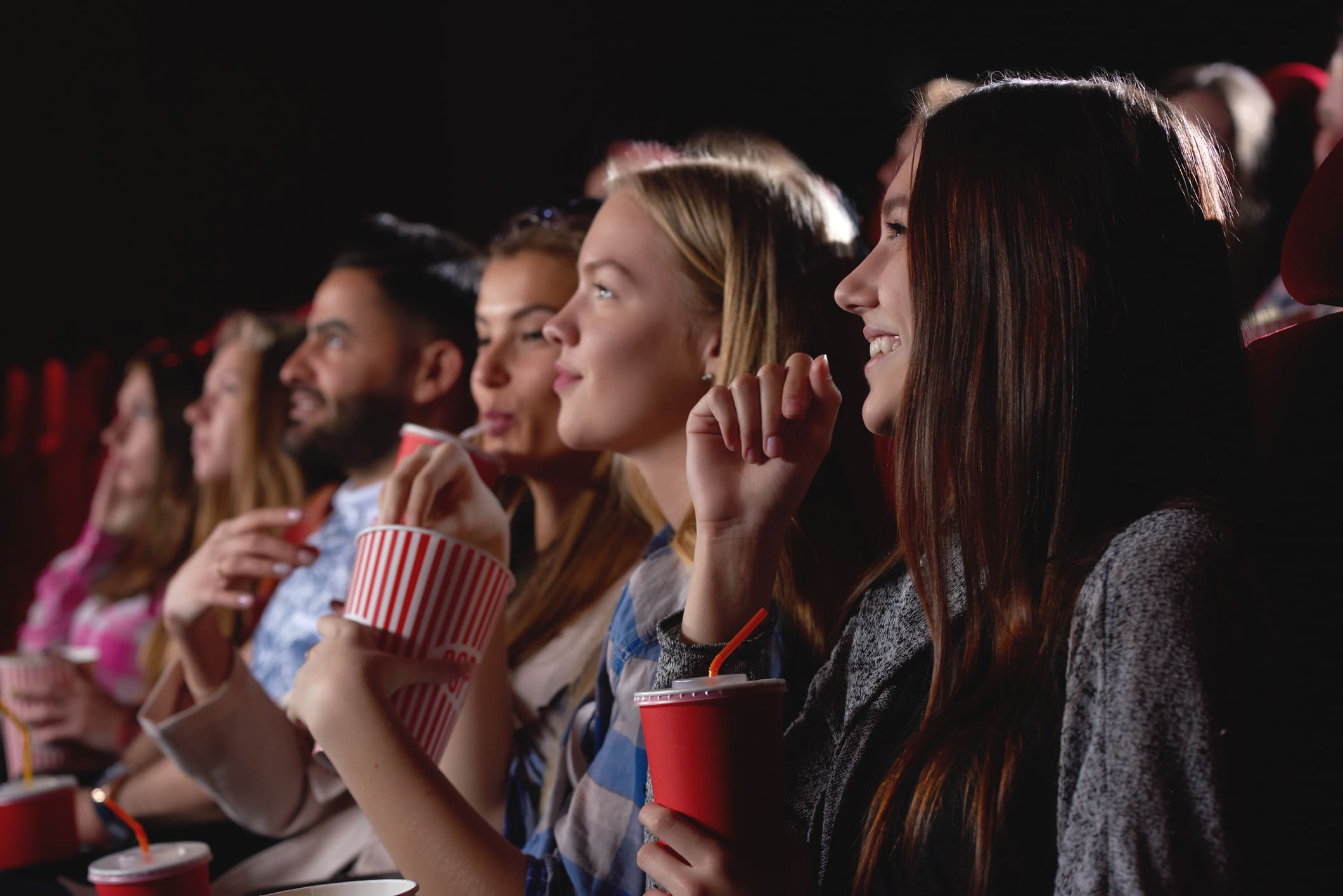 Group of people enjoying movie at the cinema